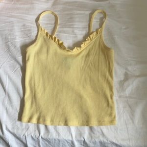 Yellow spaghetti strap crop top